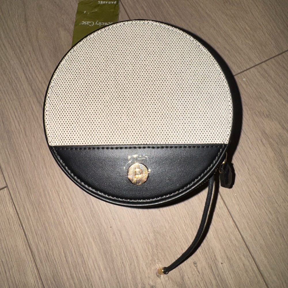 Black and White Circular Jewelry Bag with Gold Accent
